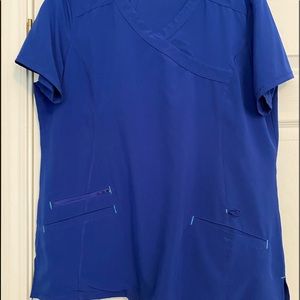 Blue scrubs w/ deep pocket and elasticated waist with drawstring.